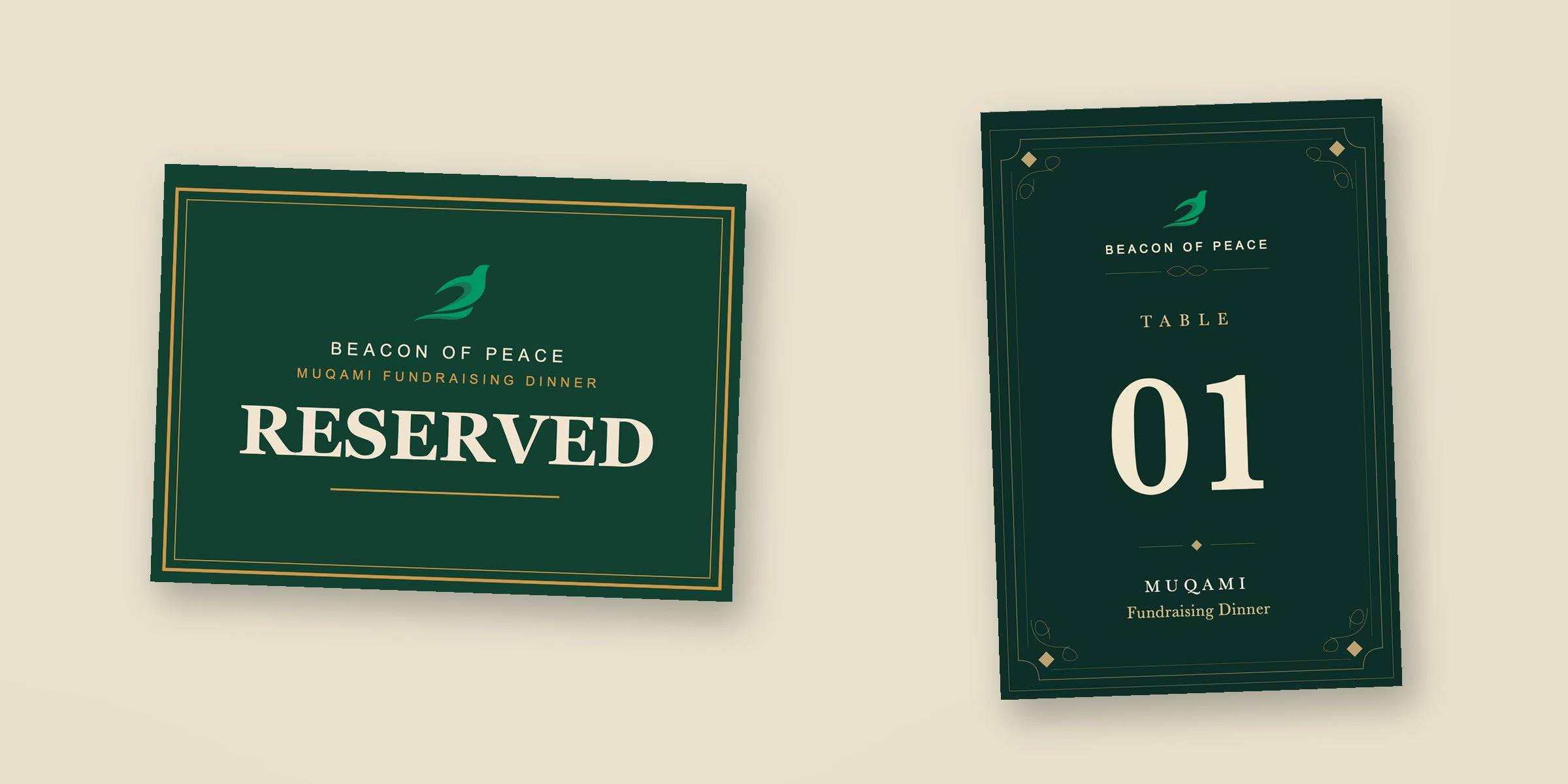 A double-sided ‘Reserved’ table sign and a ‘Table 01’ fold-over table number, both in green and gold